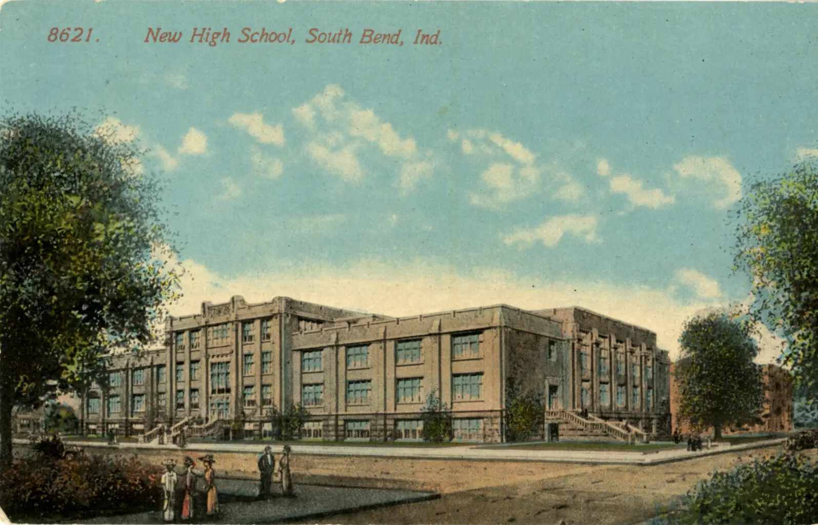 Illustrated vintage postcard showing "New High School" in South Bend, Indiana. The large brick school building features tall windows and prominent staircases on both sides of the entrance. People in early 20th-century clothing are gathered on the sidewalk in front, with trees and blue skies completing the scene.