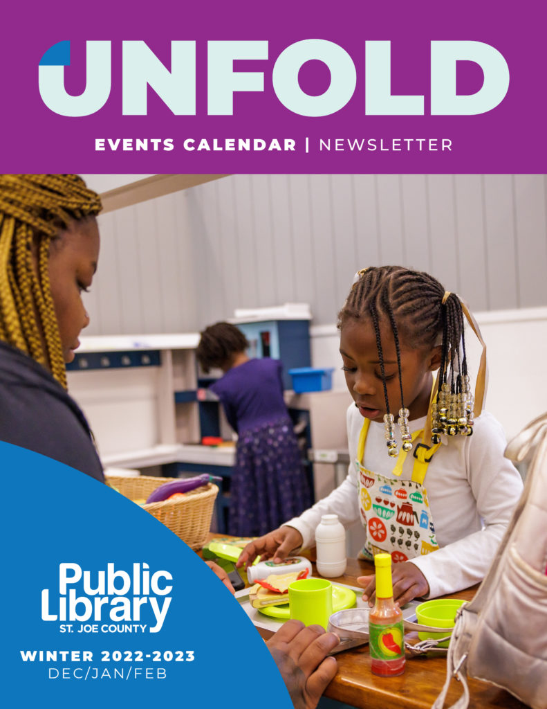 Cover of 2022-2023 Unfold Events Calendar Newsletter. A young girl plays in the Library's Tiny Town play area.